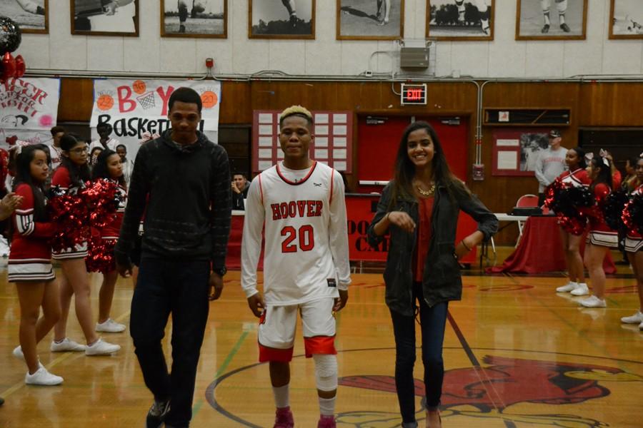 Senior Albert Frank walks with his family and friends. 
