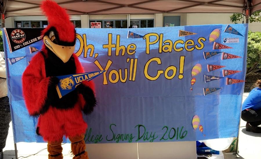 The Hoover Cardinal mascot holds up a UCLA flag.